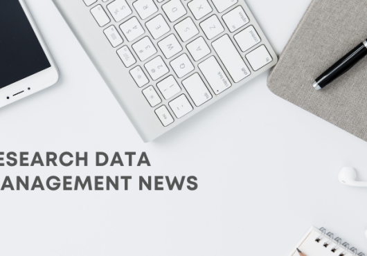 News banner with white background with iPhone, keyboard, notebook, pen, earbuds